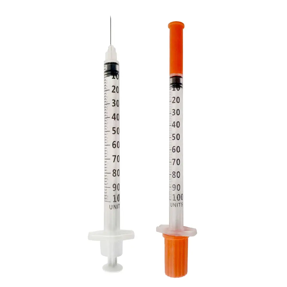 Two sterile insulin syringes with orange safety caps, shown upright on a white background.